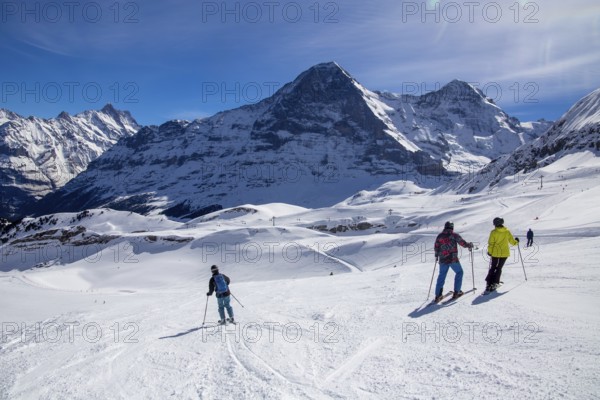 25 March 2024: Skiing against the backdrop of the north face of the Eiger in Grindelwald, Switzerland, Europe