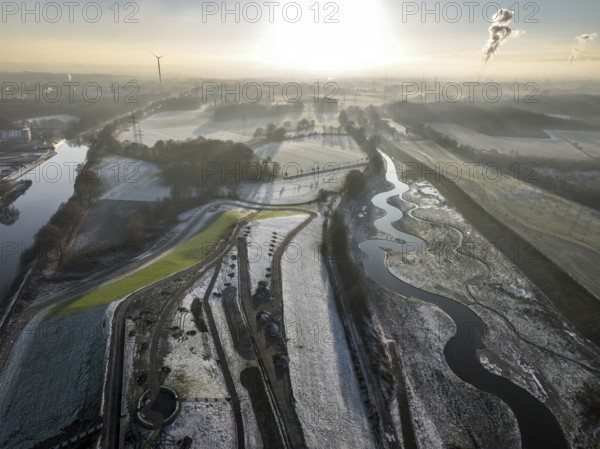 Recklinghausen, Castrop-Rauxel, North Rhine-Westphalia, Germany, winter landscape, EMSCHERLAND construction project, a 37-hectare water and nature discovery park at the water crossroads of the Rhine-Herne Canal (left) and the renaturalised Emscher (right) on the city limits of Recklinghausen and Castrop-Rauxel. The ecological focus at the confluence of the Suderwicher Bach (far right) and Emscher will also be a future garden for the International Garden Exhibition 2027. Before the renaturalisation, the Emscher river system was an open, above-ground wastewater channel, combined sewer with surface water and wastewater, Europe