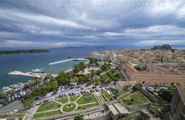 Corfu Town, Corfu, Greece, City overview Corfu Town with the Old Harbour, the Greek Orthodox Church of Agios Spiridon and the New Fortress. Behind mainland Albania, Europe