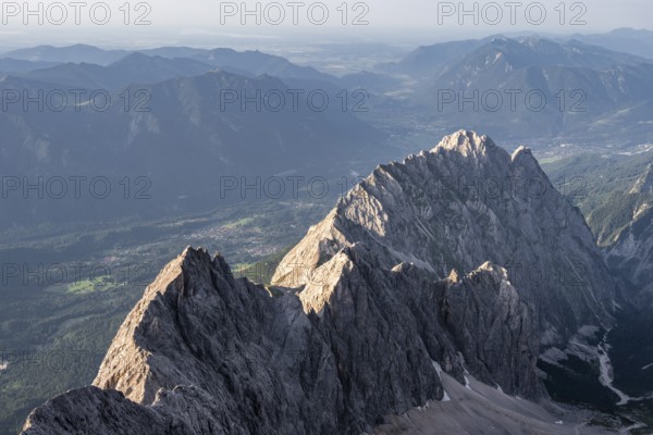 Steep rocky ridge, Waxensteinkamm, with summit Waxenstein, in the evening light, view from the summit of the Zugspitze, Wetterstein range, Bavaria, Germany, Europe