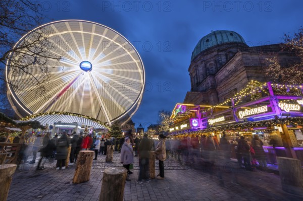 Ferris wheel at the winter village, Christmas market at dusk, St Elisabeth's Church on the right, Jakobsplatz, Nuremberg, Middle Franconia, Bavaria, Germany, Europe