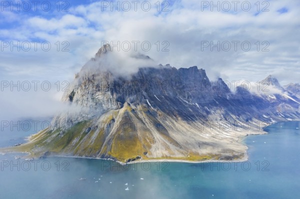 Gnalberget, mountain with steep sea cliffs in Hornsund fjord at Gnålodden in summer, Svalbard, Spitsbergen, Norway, Europe