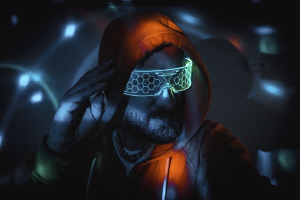 Bearded man wearing futuristic neon glasses and hoodie, touching his head, immersed in a cyberpunk, virtual reality environment with bright lights
