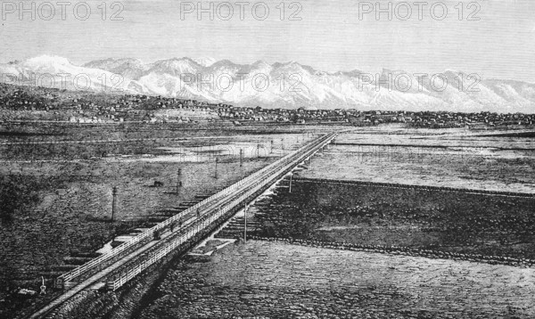 The city of Zion, city of the Mormons, on the Great Salt Lake with the snow-covered mountain landscape of the Wasatch Mountains, railway line, travel, USA, historical illustration 18888, North America