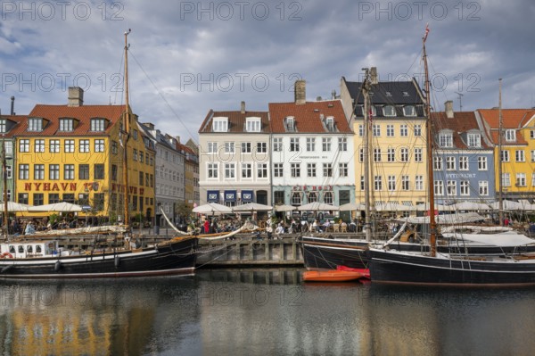 Nyhavn, in the Frederiksstaden district, harbour district with houses over 300 years old, moored sailing boats, promenade with many cafés, pubs, restaurants, canal, tourist attraction, Copenhagen, Denmark, Europe