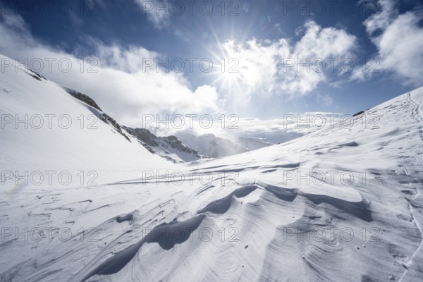 Snow-covered mountain landscape on the Wildhorn with sun star, High tour, Bernese Alps, Bernese Oberland, Switzerland, Europe