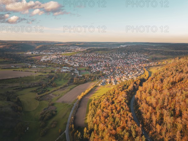 Aerial view of a town surrounded by autumnal forests and fields, Lindenrain industrial estate, Gechingen, Black Forest, Germany, Europe