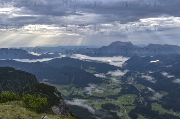 View from Edelweißlahner to the valley basin of Ramsau and Berchtesgaden with fog and sunbeams, Berchtesgaden Alps, Bavaria, Germany, Europe