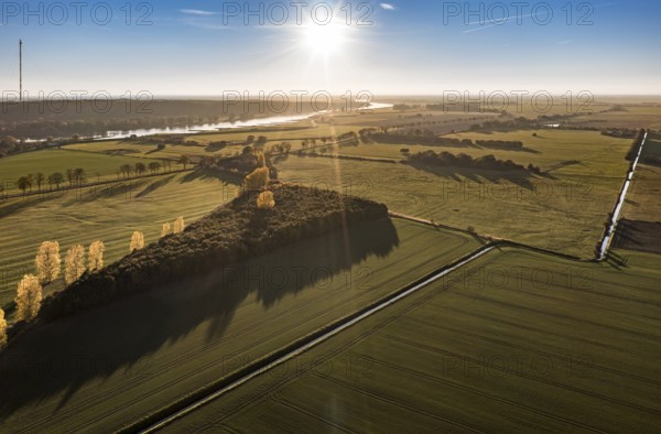 Aerial view of farmland and river Elbe near Lenzen, view to Höhbeck radio mast, sunset, Germany, Europe