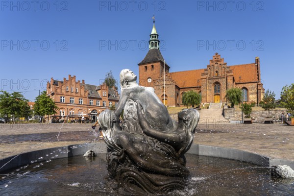 Mermaid Fountain and Church of Our Lady on the market square in Svendborg, Denmark, Europe