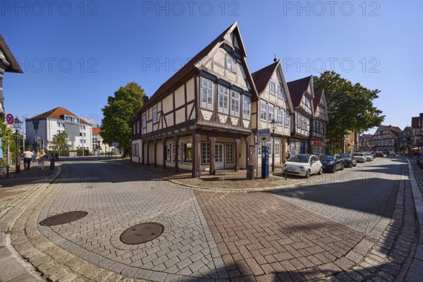 Historic half-timbered houses, city centre, concrete pavement, hard shoulder with parked cars, intersection of Schuhstraße and Am heiligen Kreuz, Celle, Lüneburger Heide, district of Celle, Lower Saxony, Germany, Europe