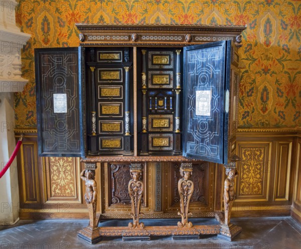 Decorative antique wooden cabinet with detailed engraving and open doors, Italian cabinet in the Salon de Francoir ler, Chenonceau Castle, Château de Chenonceau, moated castle, Chenonceaux, Indre-et-Loire, Centre-Val de Loire, France, Europe
