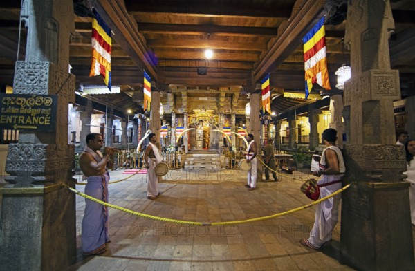 Drummers and flute players at a shrine in the Buddhist Temple of the Tooth or Sri Dalada Maligawa, Kandy, Central Province, Sri Lanka, Asia