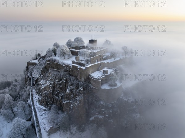Aerial view of the Hegau volcano Hohentwiel with Germany's largest fortress ruins on a cold, foggy winter morning, in front of sunrise, Singen am Hohentwiel, district of Constance, Baden-Württemberg, Germany, Europe