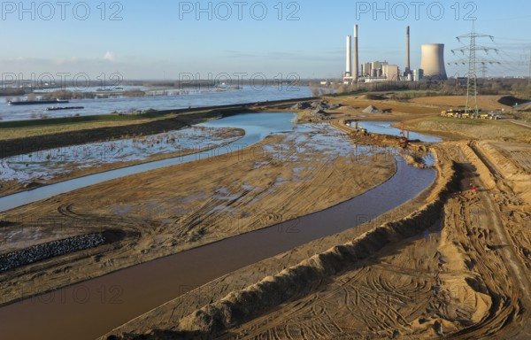 Dinslaken, North Rhine-Westphalia, Germany, New Emscher estuary into the Rhine. Construction site of the new Emscher estuary in front of the decommissioned STEAG coal-fired power station in Voerde. The mouth of the Emscher into the Rhine is being moved almost 500 metres north from Dinslaken to Voerde. Fish will then be able to swim barrier-free up the new Emscher from the Rhine through a newly created floodplain area. Following the construction of a parallel sewer, the Emscher has been completely free of sewage since January 2022. The river was previously an open, above-ground combined sewer with rainwater and wastewater, Europe