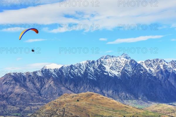 Paragliding over the Remarkables mountain range, Queenstown, South Island, New Zealand, Oceania