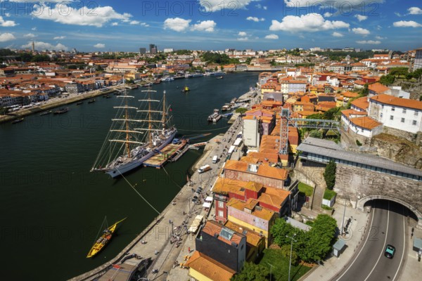 Aerial view of Porto city and Vila Nova de Gaia and Douro river with moored sailling ship from Dom Luis bridge I. Porto, Portugal, Europe