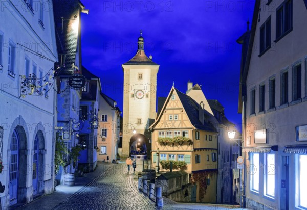 Plönlein and the Spitalgasse with the Siebersturm in the old town centre of Rothenburg ob der Tauber in the evening. Rothenburg, Bavaria, Germany, Europe