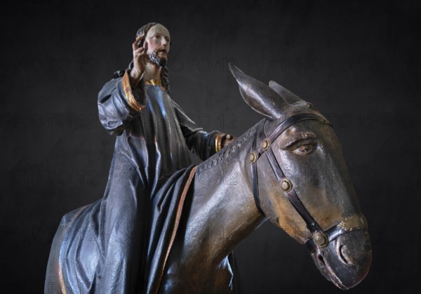 Christ on the palm donkey, detail on dark background, wooden figure from around 1880, Dominican convent in Wettenhausen, Swabia, Bavaria, Germany, Europe