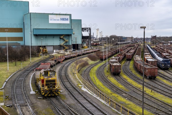 Hüttenwerke Krupp-Mannesmann, HKM in Duisburg, halls of the blast furnace steelworks, tracks of the marshalling yard, freight wagons with scrap metal, for melting down, North Rhine-Westphalia, Germany, Europe