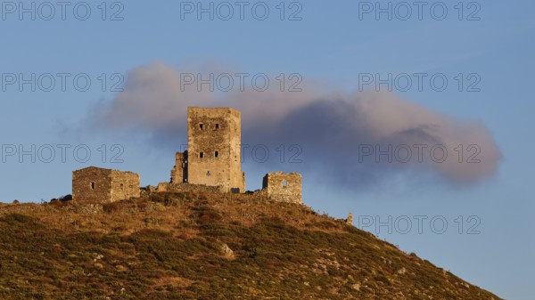 Sunset colours the clouds over the imposing ruins of a fortress on a mountain, residential tower on a mountain, Mani peninsula, Peloponnese, Greece, Europe