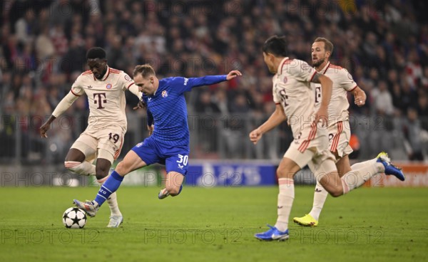 Alphonso Davies Bayern FC Munich FCB (19) v Marko Rog GNK Dinamo Zagreb (30) Harry Kane FC Bayern Munich FCB (09) Min-jae Kim FC Bayern Munich FCB (03) Champions League, Allianz Arena, Munich, Bavaria, Germany, Europe