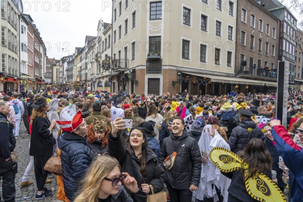 Rose Monday parade in Düsseldorf, after the parade thousands of people in the old town, in the Rheinstraße, at the Altbierbrauerei Uerige, North Rhine-Westphalia, Germany, Europe