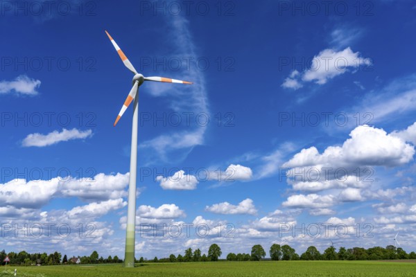 Wind turbine, wind energy plant from the manufacturer Enercon, blue sky with many white clouds, near Schermbeck, North Rhine-Westphalia, Germany, Europe