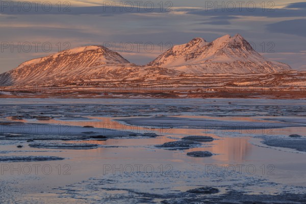 Morning light on Bergen on the coast, icy fjord, Breiddalsvik, East Fjords, Iceland, Europe