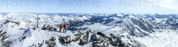 Two ski tourers on the summit of Cevedale, Alpine panorama, Aerial view, Snow-covered mountain landscape, Ortler group, Trento, Italy, Europe