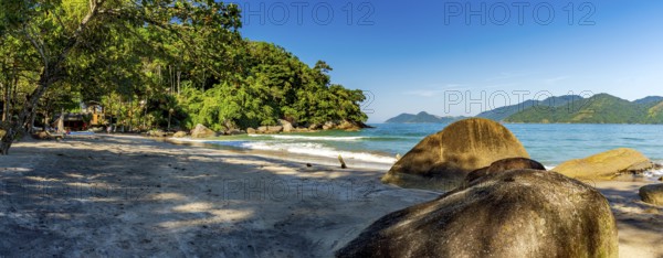 Castelhanos beach surrounded by forest and mountains on the island of Ilhabela in Sao Paulo, Castelhanos beach, Ilhabela, Sao Paulo, Brazil, South America