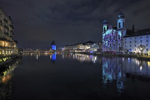 Water tower and Jesuit church on the right with light installation, on the Reuss at dusk, Old Town, Lilu, Light Festival 2025, Lucerne, Canton of Lucerne, Switzerland, Europe
