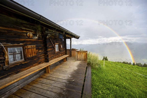 Mountain hut in the rain with rainbow, Hochbrixen, Brixen im Thale, Kitzbühel Alps, Tyrol, Austria, Europe