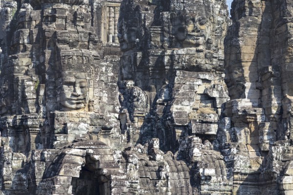 Panoramic image of giant stone-carved faces of the Bodhisattva Lokeshvara, also known as Avalokiteshvara, Bayon Temple, Angkor Thom, UNESCO World Heritage Site, Angkor Wat, Siem Reap, Cambodia, Asia