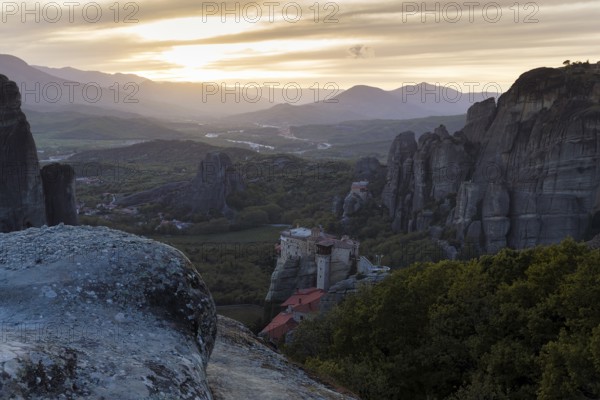 Hermitages between high cliffs, monasteries on sandstone formations, Meteora, sunset, Thessaly, Greece, Europe