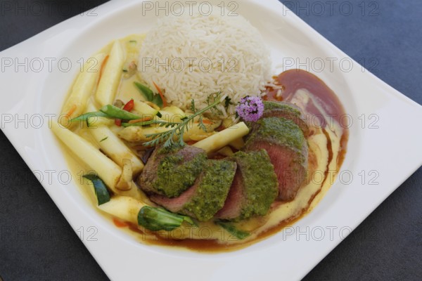 Froben Restaurant am Schloss, restaurant, gastronomy, eating and drinking, food, lamb, fillet in herb coating, rice, asparagus, vegetables, plated, Meßkirch, Baden-Württemberg, Germany, Europe