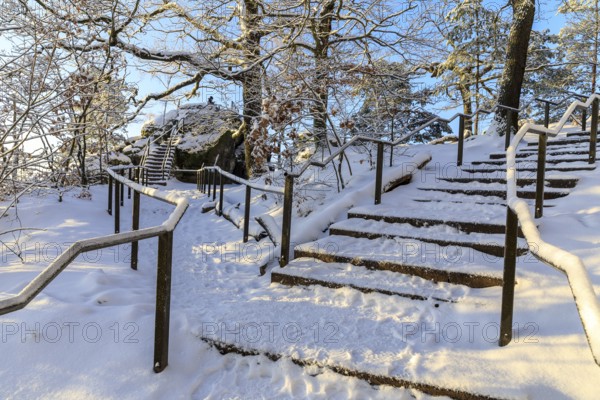 Stairs in a snow-covered rocky landscape on the ascent to the Bastei, turn-off to Kanapee Aussicht, hiking trail from Rathen, Saxon Switzerland, Saxony, Germany, Europe