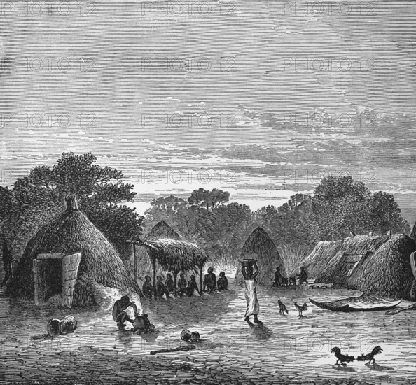 Village view with huts in the tropics, locals sitting in the shade, woman carrying a bowl on her head, free-range chickens, travelling, Togo, historical illustration 1886, Africa