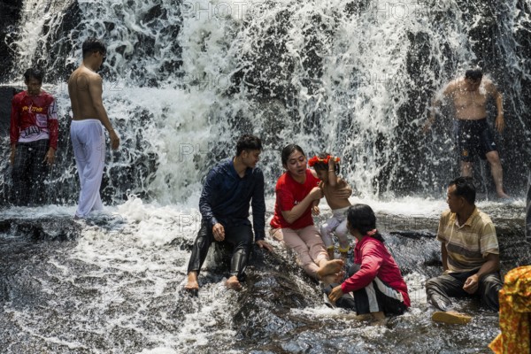 Kulen waterfall with bathing people, Phnom Kulen National Park, Siem Reap, Cambodia, Asia