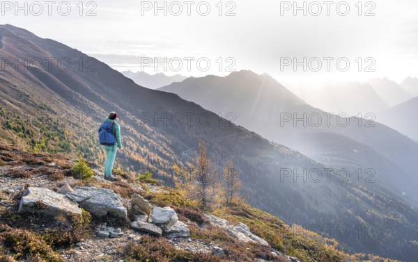 Hiker on the Venet in the morning light, view from Venet, Ötztal Alps, Tyrol, Austria, Europe