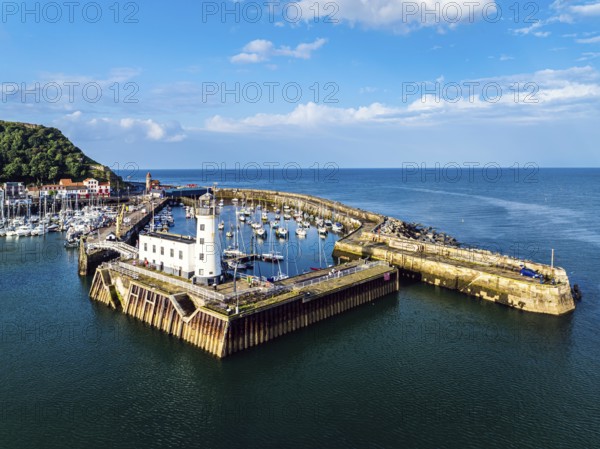 Scarborough Lighthouse and Harbour from a drone, Vincent Pier, Scarborough, North Yorkshire, England, United Kingdom, Europe