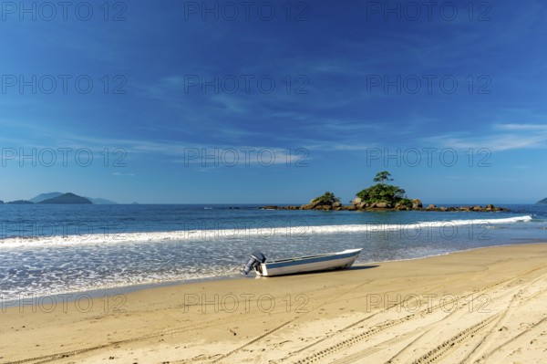 Speedboat on the sand of remote Castelhanos beach on the island of Ilhabela, Castelhanos beach, Ilhabela, Sao Paulo, Brazil, South America