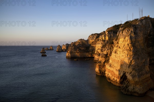 Colourful cliffs and rocks at sunrise on the beach, Praia da Dona Ana, Lagos, cliffs, Atlantic Ocean, Algarve, Portugal, Europe