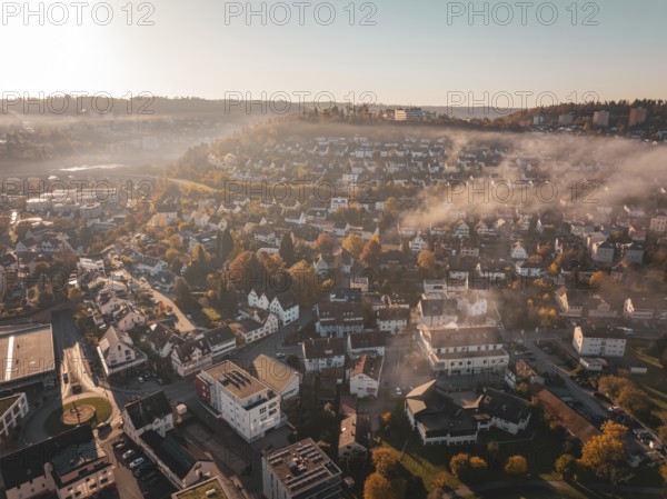 Town with streets and buildings under a foggy autumn atmosphere, Nagold, Black Forest, Germany, Europe
