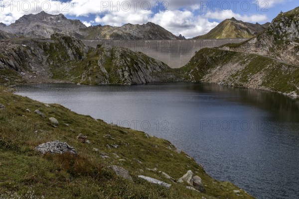 Dam wall of the Naret reservoir, Lago di Naret, in front Lake Scuro, Lago Scuro, behind Ticino mountains, Sambuco valley, Vale Sambuco, near Fusio, Lavizzara, Canton Ticino, Switzerland, Europe