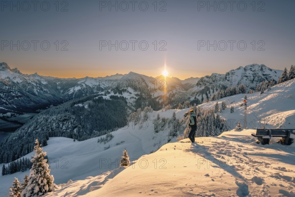 Summit bliss in the snow-covered winter landscape in the Tannheimer Tal in the Alps on the Neunerköpfle, Tyrol, Austria, Europe