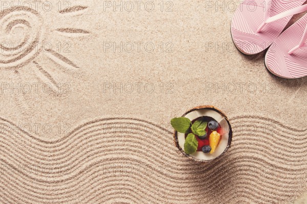 Abstract background, Summer wallpaper, drawing on sand, sea waves and sun, coconut with summer berries, flip-flops, horizontal, no people