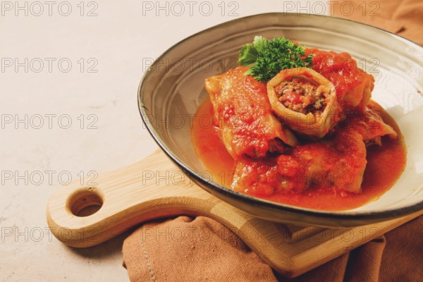 Stuffed cabbage rolls, with minced meat, in tomato sauce, on a beige background, food and drink, healthy eating, healthy lifestyle, cuisine, rustic, cabbage roll, top view, no people