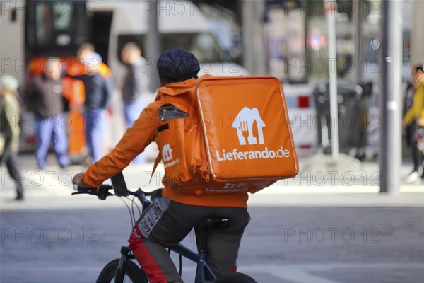 Driver of the food delivery service Lieferando, photographed in the city centre of Mannheim