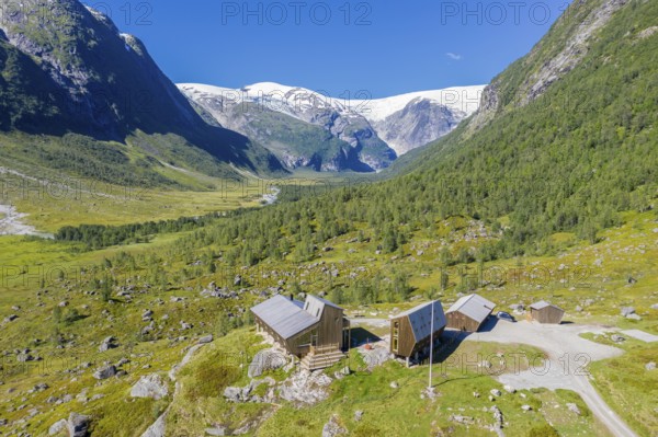 Aerial view of tourist cabin Tungestølen at the glacier Jostedalsbreen, valley Langedalen in the back, Sognefjord region, Norway, Europe